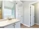 Bathroom vanity with tile flooring, soaking tub, and neutral walls at 2554 Willenhall Way, Lithonia, GA 30058