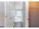 Bright bathroom with a large tub, white tile surround, and neutral walls at 2554 Willenhall Way, Lithonia, GA 30058