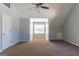 Bedroom showcasing neutral walls, a window with natural light, and carpeted floors at 2554 Willenhall Way, Lithonia, GA 30058