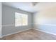 Neutral bedroom with a window providing natural light and tiled flooring at 2554 Willenhall Way, Lithonia, GA 30058