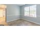Dining area with chair rail, tiled floor, and a bright window at 2554 Willenhall Way, Lithonia, GA 30058