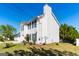 Charming two-story home with white siding, black shutters, and well-manicured landscaping at 2554 Willenhall Way, Lithonia, GA 30058