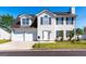 Charming two-story home features a two-car garage and a well-maintained front yard at 2554 Willenhall Way, Lithonia, GA 30058
