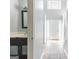 Entryway with tile flooring leading to front door and half bathroom at 2554 Willenhall Way, Lithonia, GA 30058