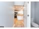 Hallway with half bathroom opens to a kitchen and dining area at 2554 Willenhall Way, Lithonia, GA 30058