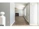 Hallway featuring wood floors leading to the living room and a fireplace at 2554 Willenhall Way, Lithonia, GA 30058