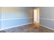 Neutral living room featuring chair rail and tiled floors at 2554 Willenhall Way, Lithonia, GA 30058