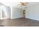 Open living room with hardwood floors leads to staircase and kitchen at 2554 Willenhall Way, Lithonia, GA 30058