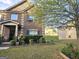 Two story brick home with manicured flower bed and lawn at 1166 Vienna Ct, Hampton, GA 30228
