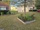 Well maintained front yard with flower beds and decorative tree at 1166 Vienna Ct, Hampton, GA 30228