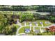 An aerial view displays beautiful homes nestled among lush greenery near a bustling highway at 155 Lawrence Dr, Villa Rica, GA 30180