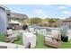 Relaxing backyard oasis featuring a pool, seating area, and artificial turf at 155 Lawrence Dr, Villa Rica, GA 30180