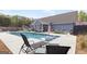 Resort-style pool featuring built-in lounge chairs and ample room for backyard entertaining at 155 Lawrence Dr, Villa Rica, GA 30180