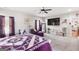 Bright bedroom features neutral walls, a plush chaise, and a large window, creating a serene retreat at 155 Lawrence Dr, Villa Rica, GA 30180