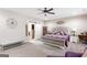 Spacious main bedroom with neutral tones, a king bed, and a sliding barn door to the closet at 155 Lawrence Dr, Villa Rica, GA 30180