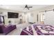 This bedroom is spacious and bright with a chaise, large TV, and a door leading to the bathroom at 155 Lawrence Dr, Villa Rica, GA 30180