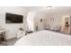 Relaxing bedroom features a large tv, comfortable seating, and neutral walls at 155 Lawrence Dr, Villa Rica, GA 30180