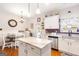 Eat-in kitchen features an island, stainless appliances, and beautiful countertops at 155 Lawrence Dr, Villa Rica, GA 30180