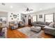 Spacious living room with hardwood floors, a ceiling fan, and a cozy seating area at 155 Lawrence Dr, Villa Rica, GA 30180