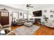Cozy living room features a fireplace, plush sectional sofa, and stylish decor for comfortable living at 155 Lawrence Dr, Villa Rica, GA 30180