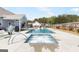 Sparkling pool and jacuzzi offer an oasis for relaxation and entertaining in the backyard at 155 Lawrence Dr, Villa Rica, GA 30180