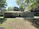 A spacious backyard with a partially shaded patio area, perfect for entertaining at 3456 Glensford Dr, Decatur, GA 30032