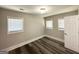 This bedroom has modern floors, fresh paint, and natural light with windows at 3456 Glensford Dr, Decatur, GA 30032