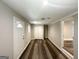 Open bedroom with new floors, fresh paint and natural light coming through the window at 3456 Glensford Dr, Decatur, GA 30032