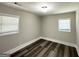 A well-lit bedroom featuring gray tone walls and modern flooring at 3456 Glensford Dr, Decatur, GA 30032