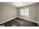 Cozy bedroom with a large window and updated floors at 3456 Glensford Dr, Decatur, GA 30032