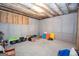 Unfinished basement offering a blank canvas for storage and customization at 115 W Wind Ct, Tyrone, GA 30290