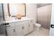 Bright bathroom with a modern vanity, sleek countertop, and a stylish shower at 115 W Wind Ct, Tyrone, GA 30290