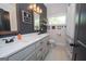 Modern bathroom with a double vanity, stylish fixtures, and a dark accent wall at 115 W Wind Ct, Tyrone, GA 30290