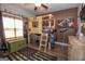 Unique bedroom featuring a custom loft bed, camouflage accents, and rustic decor at 115 W Wind Ct, Tyrone, GA 30290