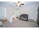 Bright, airy bedroom featuring a crib, tent, and play area, perfect for a  at 115 W Wind Ct, Tyrone, GA 30290