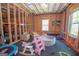 Unfinished bonus room with black floors, ready to be customized to your liking! at 115 W Wind Ct, Tyrone, GA 30290