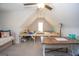 Bright bonus room with a ceiling fan and carpet flooring provides a versatile space for various activities at 115 W Wind Ct, Tyrone, GA 30290