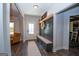 Inviting entryway features built-in bench with storage and decor, offering both functionality and style at 115 W Wind Ct, Tyrone, GA 30290