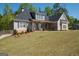 Beautiful home with a well-manicured lawn and plenty of room to spread out at 115 W Wind Ct, Tyrone, GA 30290