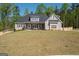 Lovely home with a lush lawn, long driveway, and privacy fence at 115 W Wind Ct, Tyrone, GA 30290
