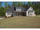 Beautiful home with lush landscaping and wooded privacy in the backyard at 115 W Wind Ct, Tyrone, GA 30290