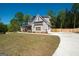 Beautifully landscaped home with a long driveway and fenced in back yard at 115 W Wind Ct, Tyrone, GA 30290