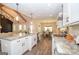 Bright open kitchen with quartz countertops, stainless appliances, and eat in island at 115 W Wind Ct, Tyrone, GA 30290