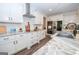 Bright kitchen features stainless appliances, subway tile backsplash and quartz counters at 115 W Wind Ct, Tyrone, GA 30290