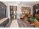 Open concept living area featuring hardwood floors, stylish decor, and seamless flow between rooms at 115 W Wind Ct, Tyrone, GA 30290