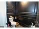 Stylish powder room with elegant black trim, modern fixtures, and sleek design at 115 W Wind Ct, Tyrone, GA 30290