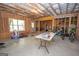 Unfinished basement features concrete floors and unfinished ceiling and walls at 115 W Wind Ct, Tyrone, GA 30290