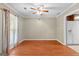Inviting dining room featuring hardwood floors, neutral walls, and a decorative ceiling fan at 324 County Line Rd, Fayetteville, GA 30215