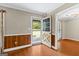 Inviting foyer with hardwood floors, wood-paneled walls, and a charming stained-glass front door at 324 County Line Rd, Fayetteville, GA 30215