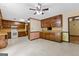Spacious kitchen featuring wooden cabinets, tile floors, and a white electric range at 324 County Line Rd, Fayetteville, GA 30215